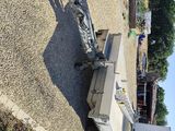 a trailer with a trailer attached to it parked in a lot