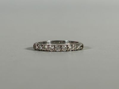 a close up of a diamond ring on a table