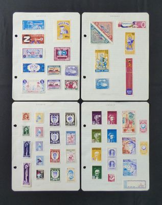 four different types of postage stamps on a black surface