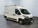 a picture of a white van parked in a room