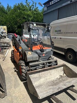 an image of a forklift parked in front of a building