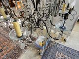 a chandelier that is sitting on the floor next to a rug
