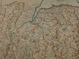 an old map of a country with mountains and lakes in the background