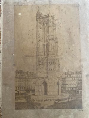 an old picture of a building with a clock on it