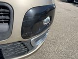 a close up of a car ' s front bumper and grille