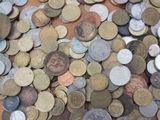 a lot of coins that are on the table