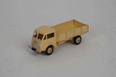 a toy truck that is sitting on a white surface