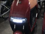 many motorcycles that are parked together in a garage