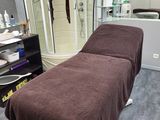 a massage table with a towel on it in a room