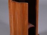 a small wooden table with a marble top on it