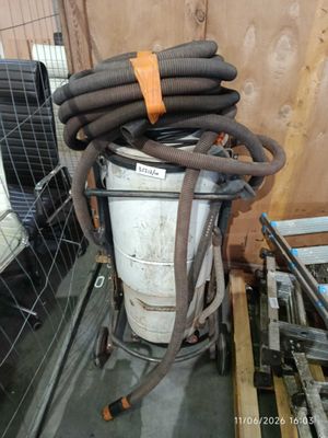 an image of a pile of hoses sitting on top of a metal container