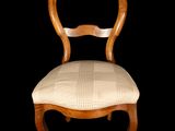 an image of a chair with a wooden frame and upholstered seat