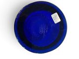 a blue glass bowl with a tag on it