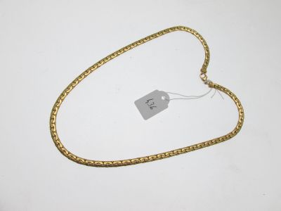 a close up of a gold chain with a price tag on it