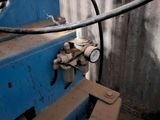 a picture of a machine that is working on a piece of metal