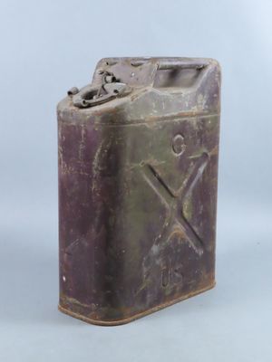 an old purple metal canister with a metal handle on a white background