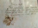 a piece of paper with writing on it sitting on a table