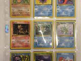 a lot of pokemon cards on display on the wall