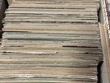 a box full of old records sitting on a table