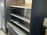 a refrigerator that has a bunch of empty shelves in it