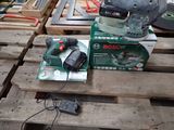 a box of tools sitting on top of a wooden pallet