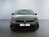 the front of a black vw golf parked in a white room