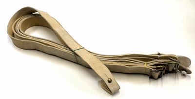 a brown leather strap with a metal hook on it