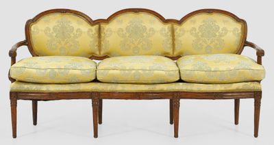 an image of a couch with a yellow and green upholstered cover