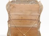 an image of a wooden chair with a gold necklace on it