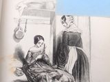un livre sur lequel figure la photo d'une femme assise sur un lit