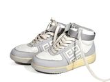 grey and white high top sneakers with a white and grey logo on the sole