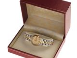 an image of a watch in a box with a watch inside of it