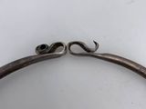 a close up of a metal frame with a handle on it