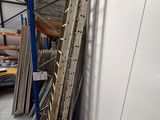 a ladder leaning against a wall in a warehouse