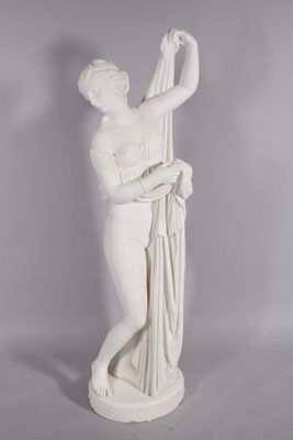 statue of a woman holding a bunch of flowers in her hands