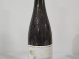 a bottle of wine that is sitting on a table