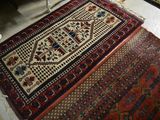 two rugs that are on the floor in a room