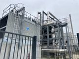 a large metal structure with pipes and pipes on it