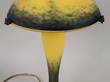 an image of a yellow and blue lamp with a black base