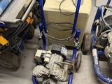 two machines sitting next to each other on the floor