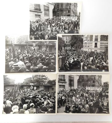 several black and white photos of a crowd of people in a city