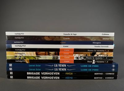 several books stacked on top of each other on a table