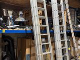 a ladder that is leaning up against a wall in a warehouse