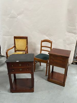 three chairs and a table in a room with a white backdrop