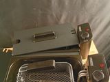 a toaster that is sitting on a wooden table