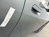 a sticker on the door of a car that has a sticker attached to it