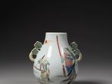a white vase with a painting on it sitting on a table
