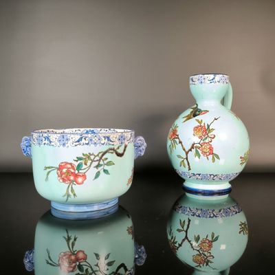 two vases sitting next to each other on a table