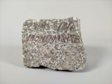 a rock that is sitting on a white surface