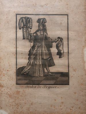 an old picture of a woman holding a dog